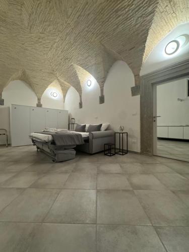 a large living room with a couch and a table at Residenze Le Lunette in Lucera