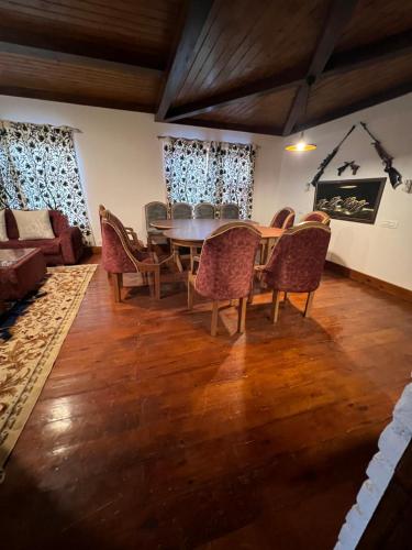 a dining room with a table and chairs at JK's The Trout Stream in Gulmarg