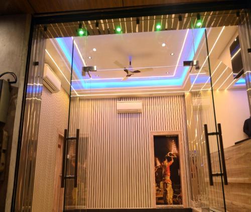 a room with a large clock on the ceiling at Hotel Shankara Residency in Varanasi