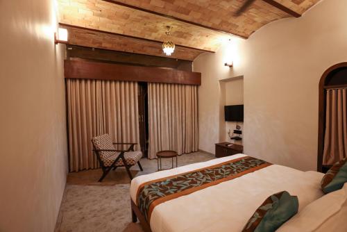 Postel nebo postele na pokoji v ubytování Le Casa Lion Resort A Premium Resort In Sasan Gir