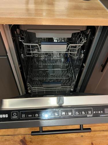 an open oven with racks inside of it at Apartamenty Warszawska in Toruń