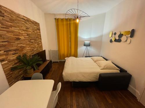 Ένα ή περισσότερα κρεβάτια σε δωμάτιο στο Saphir 1