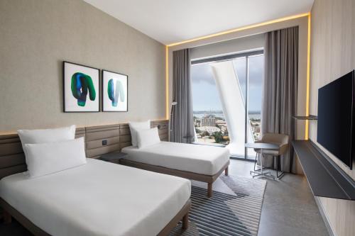 Télévision ou salle de divertissement dans l'établissement Novotel Abidjan Marcory