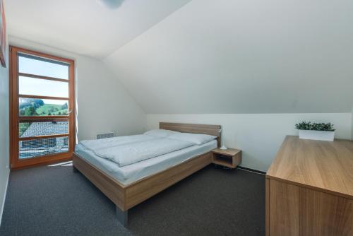 Postel nebo postele na pokoji v ubytování Horský Apartmán Říčky