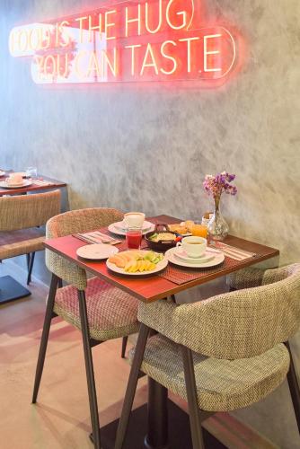 a table with plates of food on top of it at Hotel Moon & Sun Braga in Braga