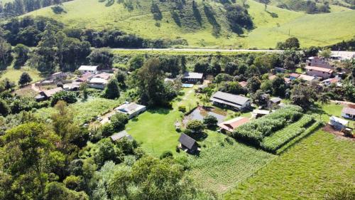 an aerial view of a small village in the hills at Chalés Baruch in Sapucaí-Mirim