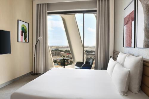 Un ou plusieurs lits dans un hébergement de l'établissement Novotel Abidjan Marcory