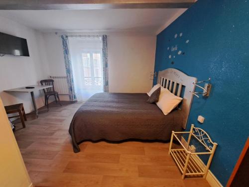 Postel nebo postele na pokoji v ubytování hôtel le Béarn