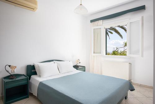 Ένα ή περισσότερα κρεβάτια σε δωμάτιο στο To Spiti Mas