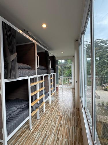 a tiny house with bunk beds in the hallway at khaosok Center Guesthouse in Khao Sok National Park