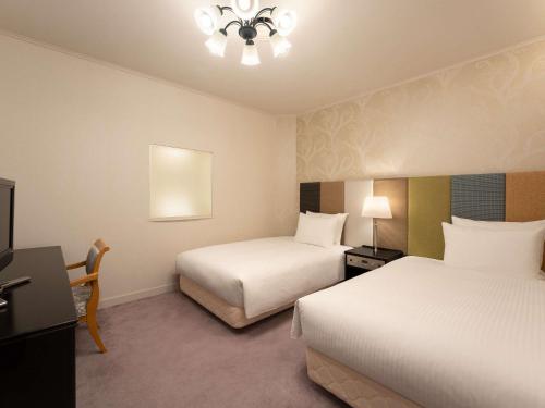 Postel nebo postele na pokoji v ubytování Grand Mercure Yatsugatake Resort & Spa