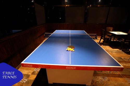 a large ping pong table in a room at Royal Retreat Lonavla - 7BHK Luxury Villa with Turf in Lonavala
