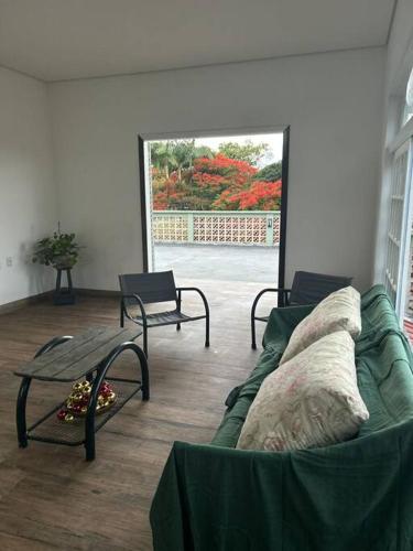 a living room with a couch and a table at Casa brisa mar in Pontal do Paraná