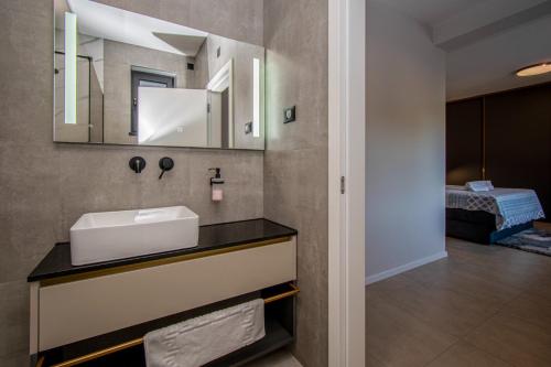 a bathroom with a sink and a mirror at Villa Bella near Rovinj and Pula in Bale