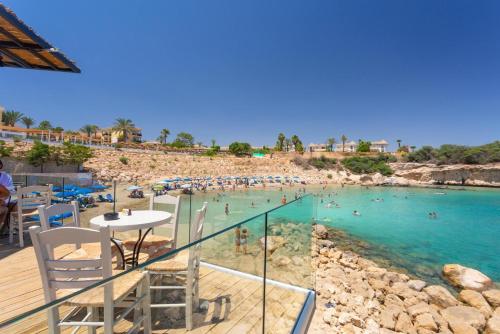 a view of a beach with people in the water at Villa Koula in Paralimni