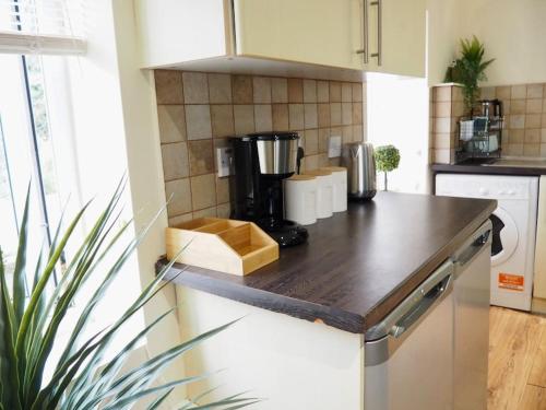 a kitchen with a counter top with a coffee maker at Central 1 Bedroom Flat up to 4 near O2 Oxford in Oxford