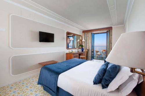 a bedroom with a large bed and a window at Alimuri Bay Resort in Meta