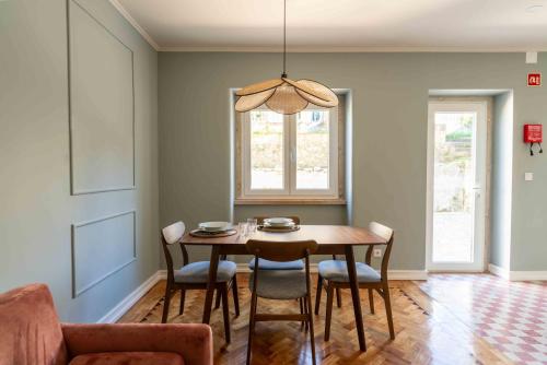a dining room with a table and chairs at Charm House Sintra 45 - Pena Garden Flat in Sintra