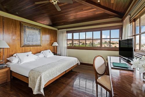 Ένα ή περισσότερα κρεβάτια σε δωμάτιο στο Elba Palace Golf Boutique Hotel - Adults Only