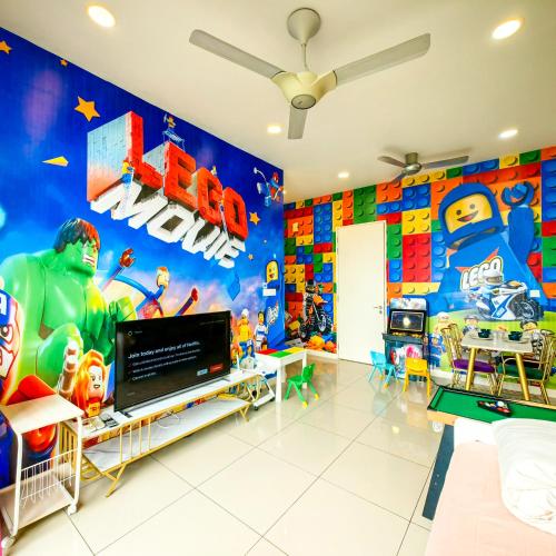 a childrens room with a superhero mural on the wall at D'Pristine Theme Suite by Nest Home at LEGOLAND in Nusajaya