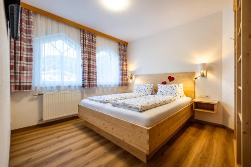 Postel nebo postele na pokoji v ubytování Ausserraingut