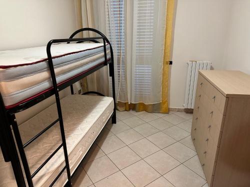 a bedroom with two bunk beds in a room at STAFFOLI Home in Pianore