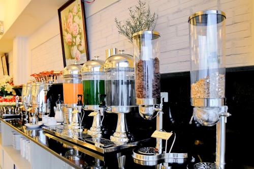a counter with many different types of food items at May Ngu Sac - Iridescent Clouds Hotel in Nha Trang
