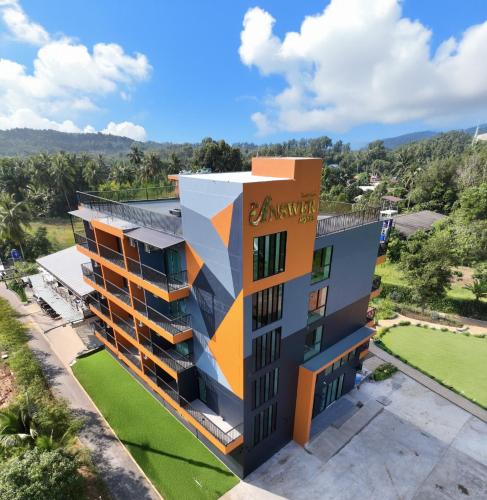 an image of a building with an arrow painted on it at The Answer Hotel in Ao Nang Beach