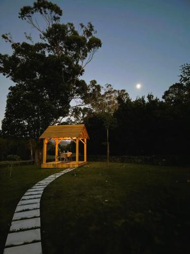 a gazebo in a park at night at Batalha Golf Villas & Spa in Ponta Delgada