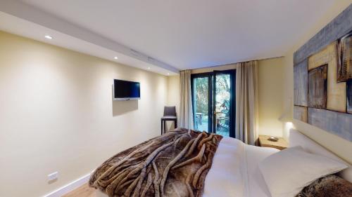 Ένα ή περισσότερα κρεβάτια σε δωμάτιο στο Apartment Roseg