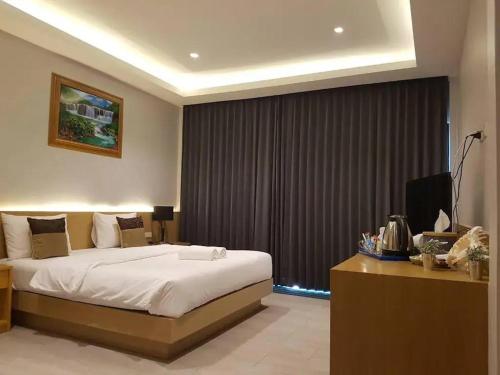 Ένα ή περισσότερα κρεβάτια σε δωμάτιο στο Mayor Hotel Villa Cha Am