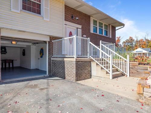 a house with a white stairway leading to a garage at Modern and Accessible 5 Bedroom Home in Cranberry, Pittsburg with Game Room in Cranberry Township