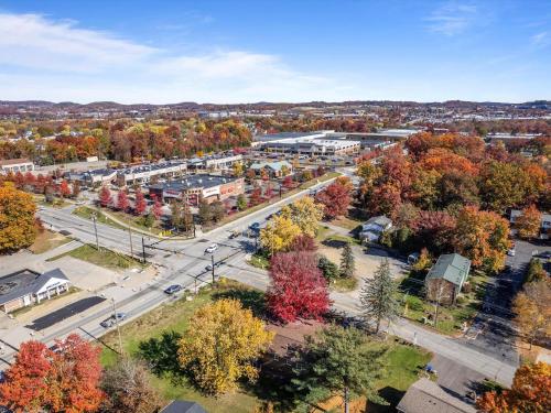 an aerial view of a town with fall foliage at Modern and Accessible 5 Bedroom Home in Cranberry, Pittsburg with Game Room in Cranberry Township