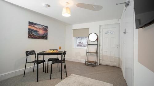 a dining room with a table and chairs at YSS The Church 2 Apartments in Redcar
