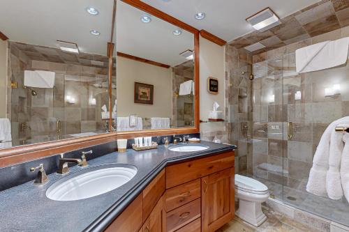 a bathroom with a sink and a shower at Lion Square Lodge South 650 in Vail