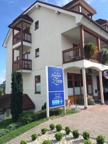 a building with a sign in front of it at Garni Hotel Zvon in Zreče