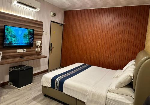 Una televisión o centro de entretenimiento en SS Hotel Seremban