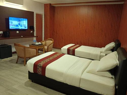 Una cama o camas en una habitación de SS Hotel Seremban