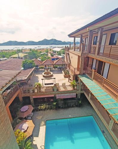 an aerial view of a house with a swimming pool at R2R Bayview Inn in Coron