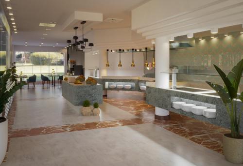 a restaurant with a kitchen and a dining room at Bordoy Don Antonio in Paguera