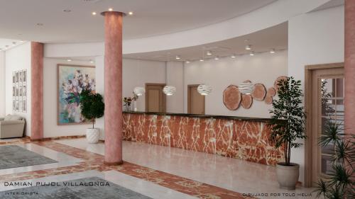 a lobby with a pillar and a counter with plants at Bordoy Don Antonio in Paguera