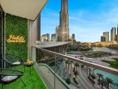a balcony with a view of the city at Luxury Two Bedroom Apartment with Balcony, Full Burj Khalifa & Fountain Views by Delujo Stays in Dubai