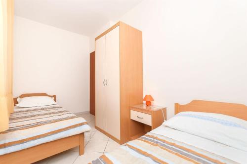 Postel nebo postele na pokoji v ubytování Apartments Brane