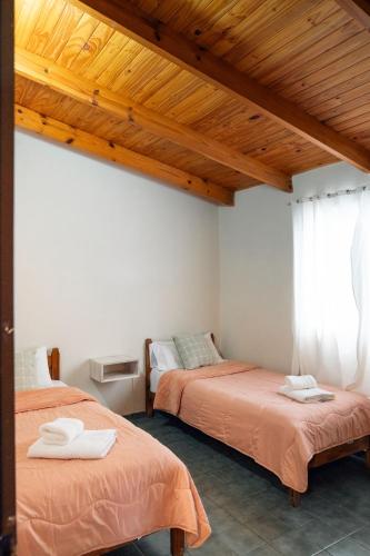 Letto o letti in una camera di Oliva Hostería y Apart