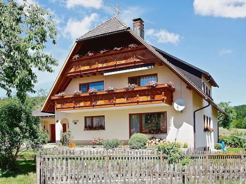 a house with a fence in front of it at Haus Ingrid in Schluchsee