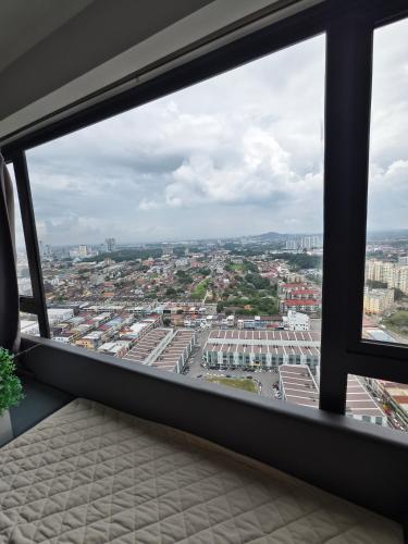 a view of a city from a window at Imperio Homestay Private Bathtub Melaka Town - Near JONKER STREET in Melaka