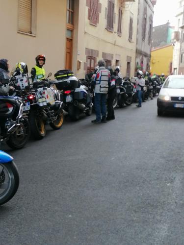 a group of motorcycles parked on the side of a street at AFFITTA CAMERE CASA DELLE ROSE in Villanova Monteleone