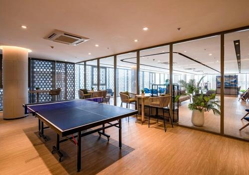 an office with a ping pong table in a room at The Sóng Vũng Tàu- SAO VIỆT Căn Hộ Nghỉ Dưỡng 5 Sao in Vung Tau