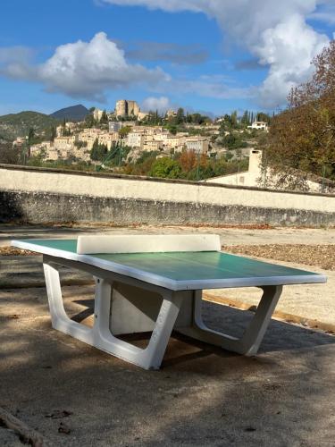 a ping pong table in front of a city at Chateau appartement tussen Mont Ventoux en Luberon in Montbrun-les-Bains
