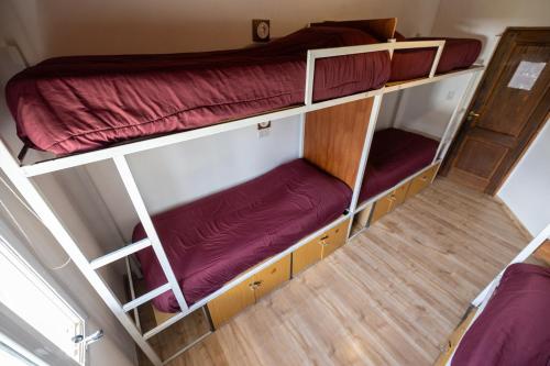 Llit o llits en una habitació de Mistico Hostel 23